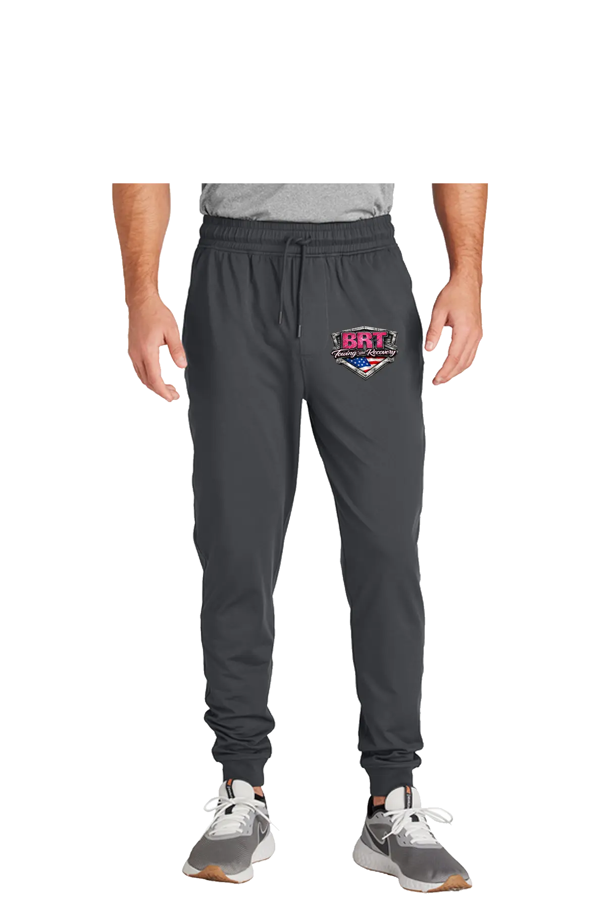 Person wearing gray jogger pants with a logo on a white background. BRT Towing and Recovery, Paper Street Print Co, Blairstown, NJ.