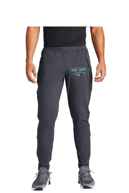 Person wearing gray jogger pants with a logo on a white backgroundRon and Sons Towing, Paper Street Print Co, Blairstown, NJ.