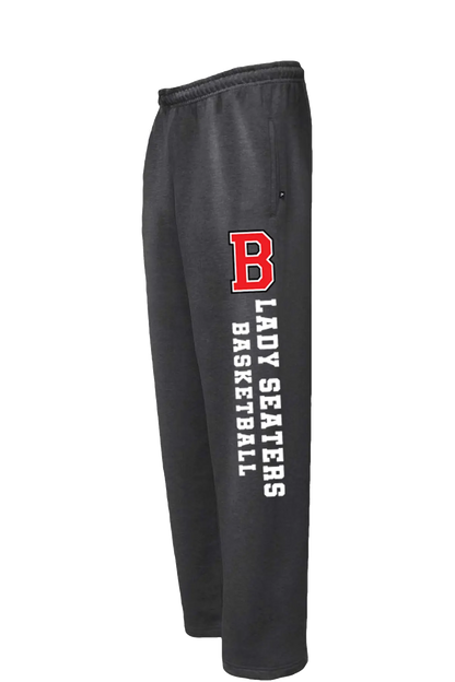Black athletic sweatpants featuring a red block letter 'B' and white vertical text reading 'LADY SEATERS BASKETBALL' on the left leg, shown against a plain white background. Paper Street Print Co, Blairstown, NJ.