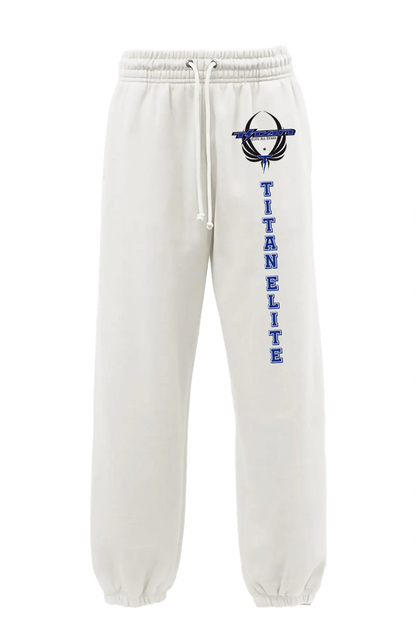 White sweatpants with 'Titan Elite' text and logo on a white background. Paper Street Print Co, Blairstown, NJ.