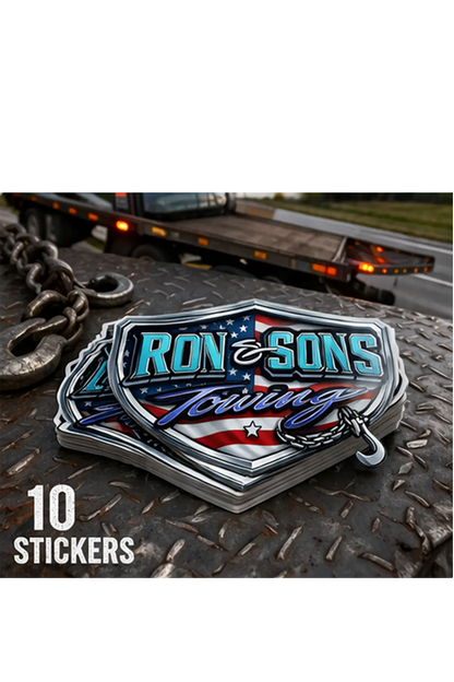 Ron and Sons Towing logo sticker with American flag design on a metal surface with towing truck in background. Paper Street Print Co, Blairstown, NJ.