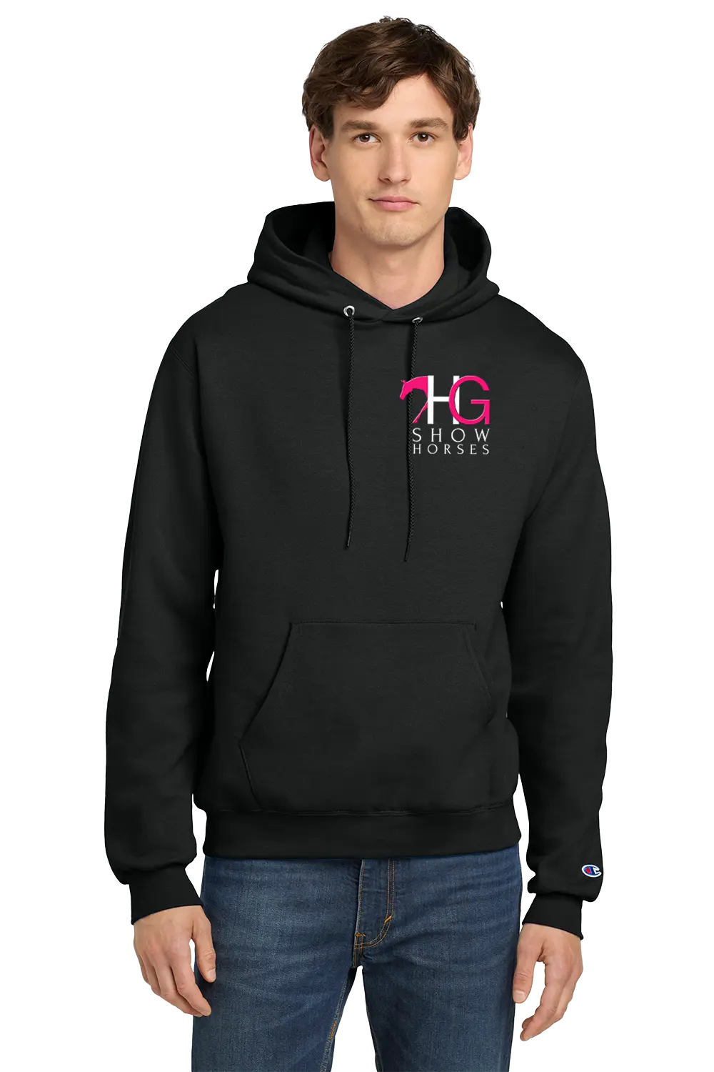 A man wearing a black pullover hoodie with a pink and white 'HG Show Horses' logo on the left chest, paired with blue jeans, photographed against a solid white background. HG Show Horses, Paper Street Print Co, Blairstown, NJ.