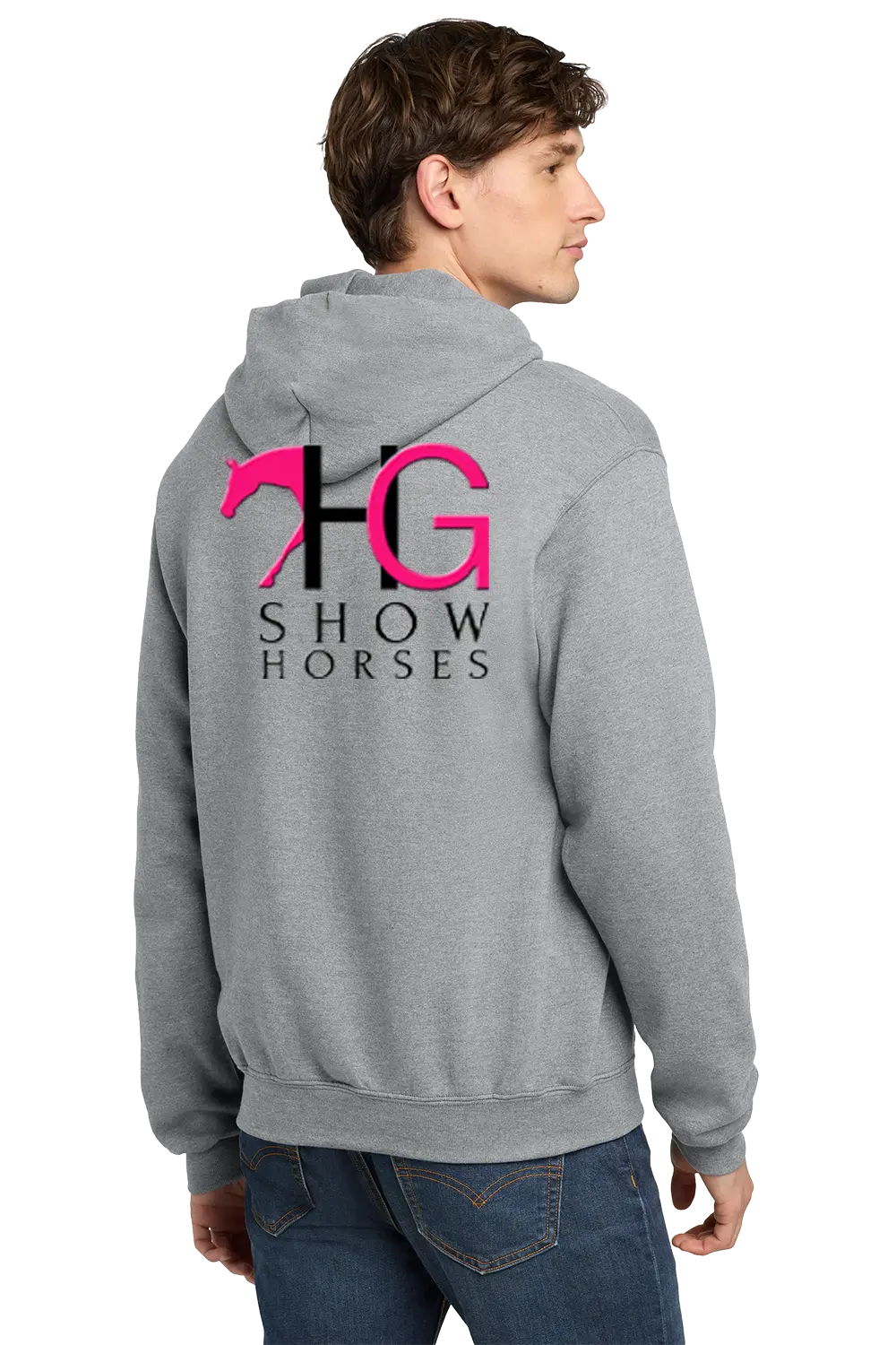 A man wearing a heather gray hoodie from the back, featuring a large graphic print with a pink horse silhouette, black and pink 'HG' letters, and 'SHOW HORSES' text. He is also wearing blue jeans against a plain white background. HG Show Horses, Paper Street Print Co, Blairstown, NJ.