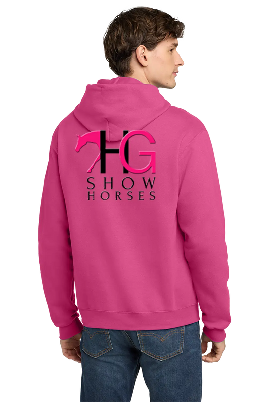 A man wearing a bright pink hoodie from the back, featuring a large black and pink 'HG SHOW HORSES' logo printed on the back, paired with blue jeans against a white background. HG Show Horses, Paper Street Print Co, Blairstown, NJ.