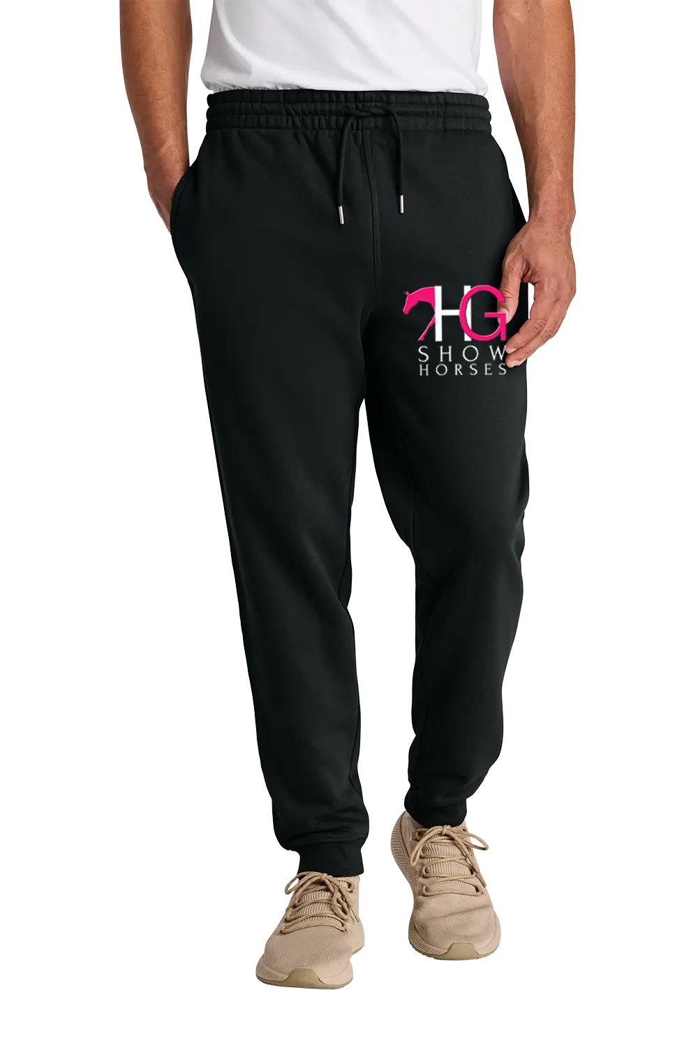 A person wearing black jogger sweatpants with a pink and white 'HC Show Horses' logo on the left thigh, paired with a white t-shirt and beige sneakers, shown from the waist down on a white background. HG Show Horses, Paper Street Print Co, Blairstown, NJ.