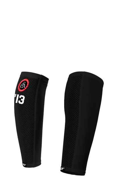 Black shin guards with a logo and number on a white background. Paper Street Print Co, Blairstown, NJ.